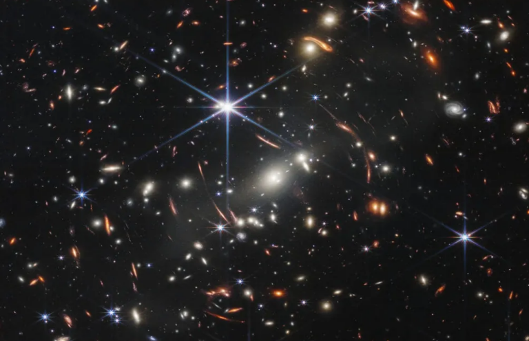 Gravitational lens shows a galaxy just 800 million years post-Big Bang